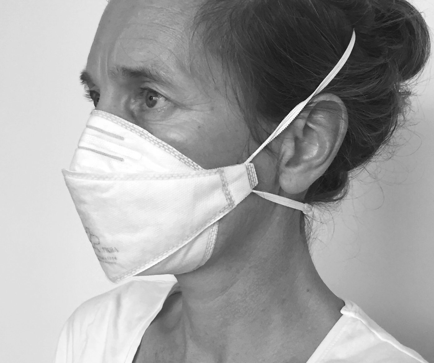 A SAFIERA filter facemask worn in profile